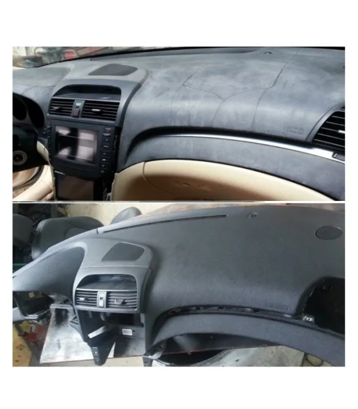 TRestauración exitosa del tablero de un Infiniti, mostrando el tapizado profesional de negro mate sobre la superficie dañada.